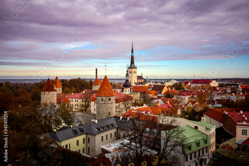Aerial urban landscape with medieval Old town, St. Olaf's Baptist Church and Tallinn city wall, beautiful panoramic view of the city of Tallinn, Estonia