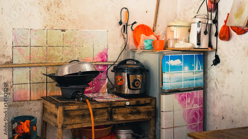 An Asian kitchen at one local eatery canteen in a small town YingDe, unsanitary, dirty, dangerous for health, a messy typical restaurant in China, Vietnam, Cambodia, India, Nepal, Myanmar, Thailand