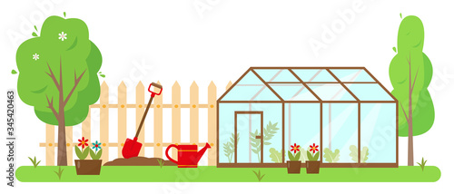 Greenhouse, gardening tools and trees
