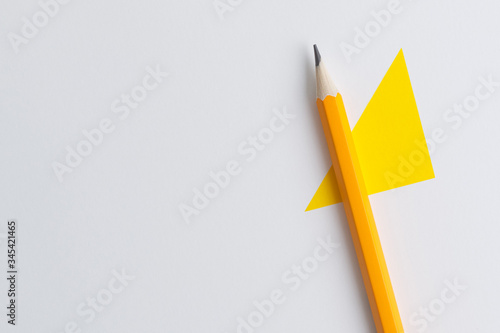 An interactive photo composition of an orange pencil and space for creative thinking (text) is used for presentation in the field of education, business or creativity
