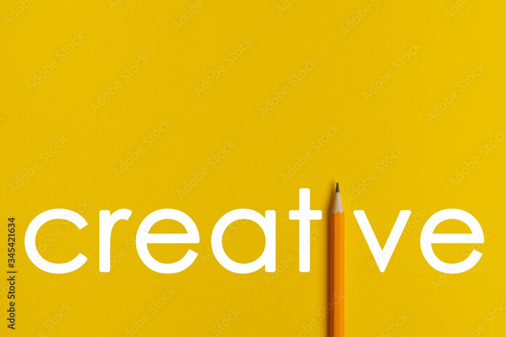 The interactive composition of a photo of an orange pencil replaces the white words of creative thinking used for presentation in the field of education, business or creativity.