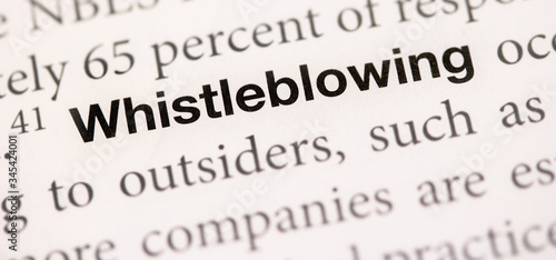 The words whistleblowing written in a dictionary