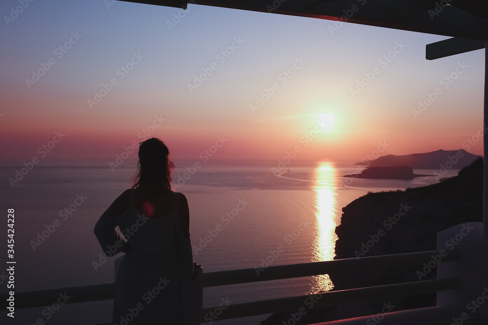 Silhouette of a women on a sunset. Island. Paradise Silhouette of a women on a sunset. Island. Paradise
