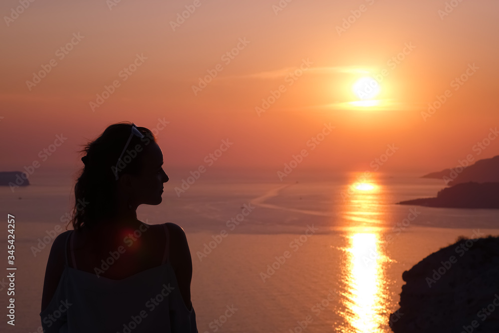 Silhouette of a women on a sunset. Island. Paradise