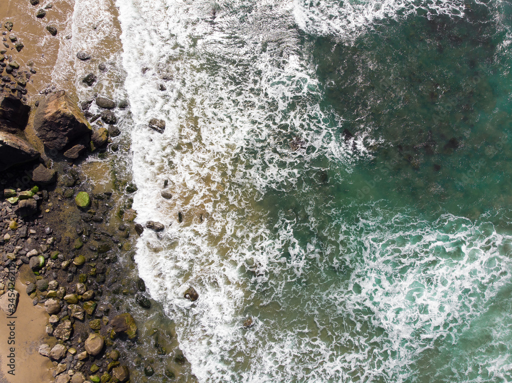 Ocean and rocky stone beach. Top view, texture and landscape. Ocean and rocky stone beach. Top view, texture and landscape.