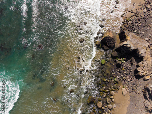 Wallpaper Mural Ocean and rocky stone beach. Top view, texture and landscape. Torontodigital.ca