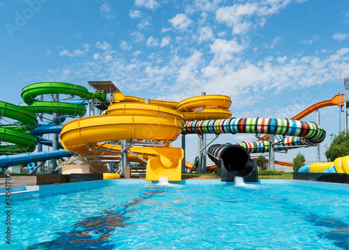Fototapeta Naklejka Na Ścianę i Meble -  Water park with colorful slides and pools