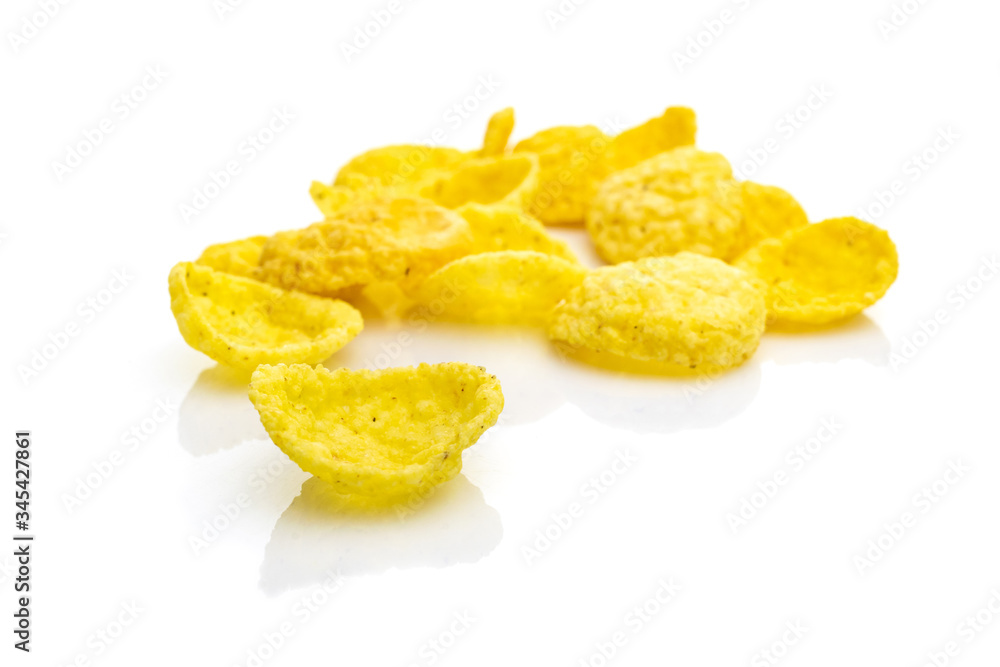 Breakfast cereal corn flakes on white. Cereal Healthy Cornflakes - snack breakfast best with milk. Dieting and detoxication concept with mineral nutrients. Macro close-up shot. Breakfast cereal corn flakes on white. Cereal Healthy Cornflakes - snack breakfast best with milk. Dieting and detoxication concept with mineral nutrients. Macro close-up shot.