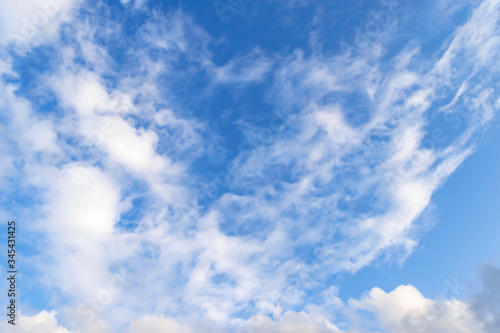 Fototapeta Naklejka Na Ścianę i Meble -  Blue sky background with a large cirrus cloud.
