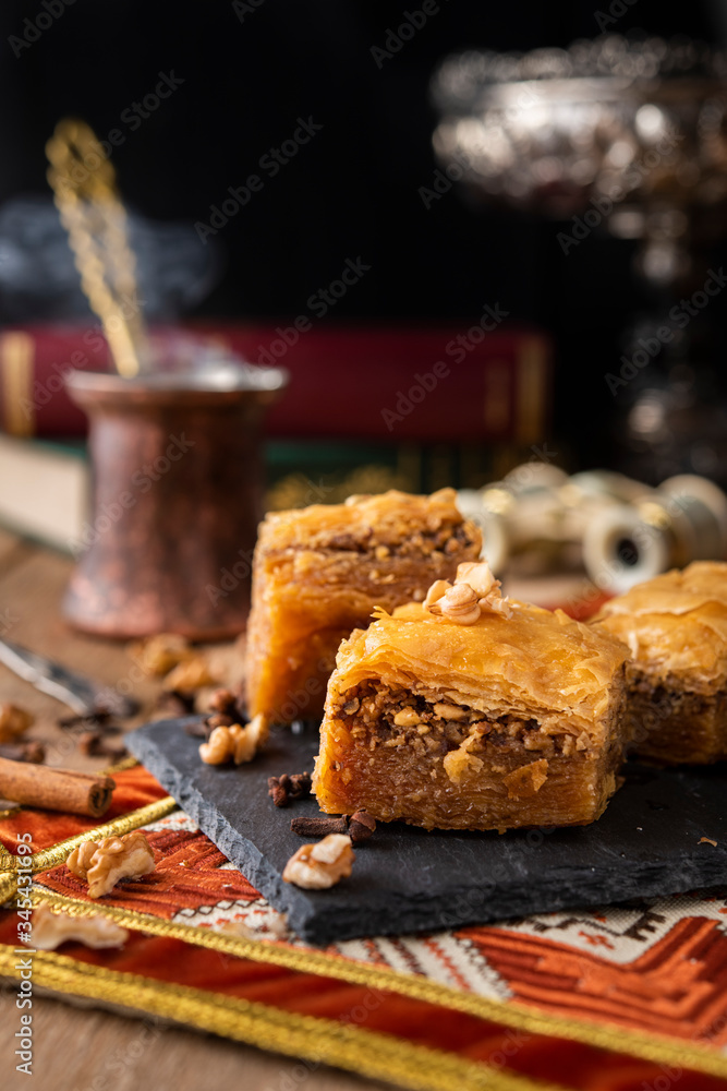 Baklava sweets with nuts on it with coffee and cinnamon Baklava sweets with nuts on it with coffee and cinnamon