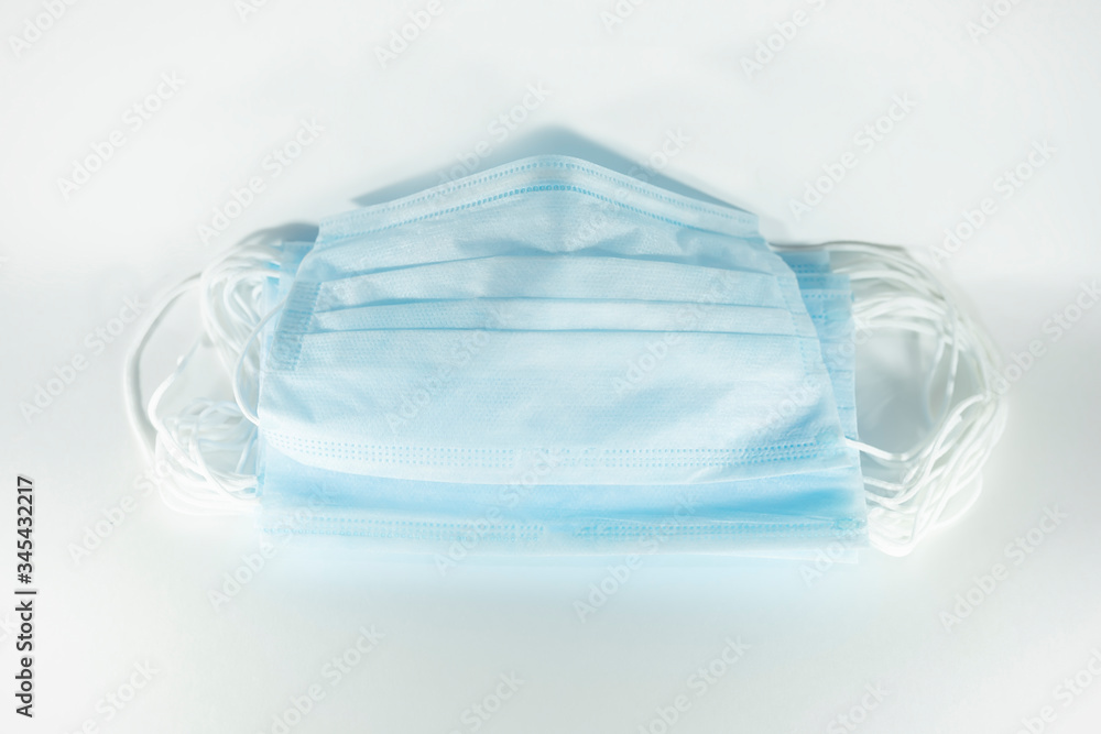 disposable blue medical mask on a white background