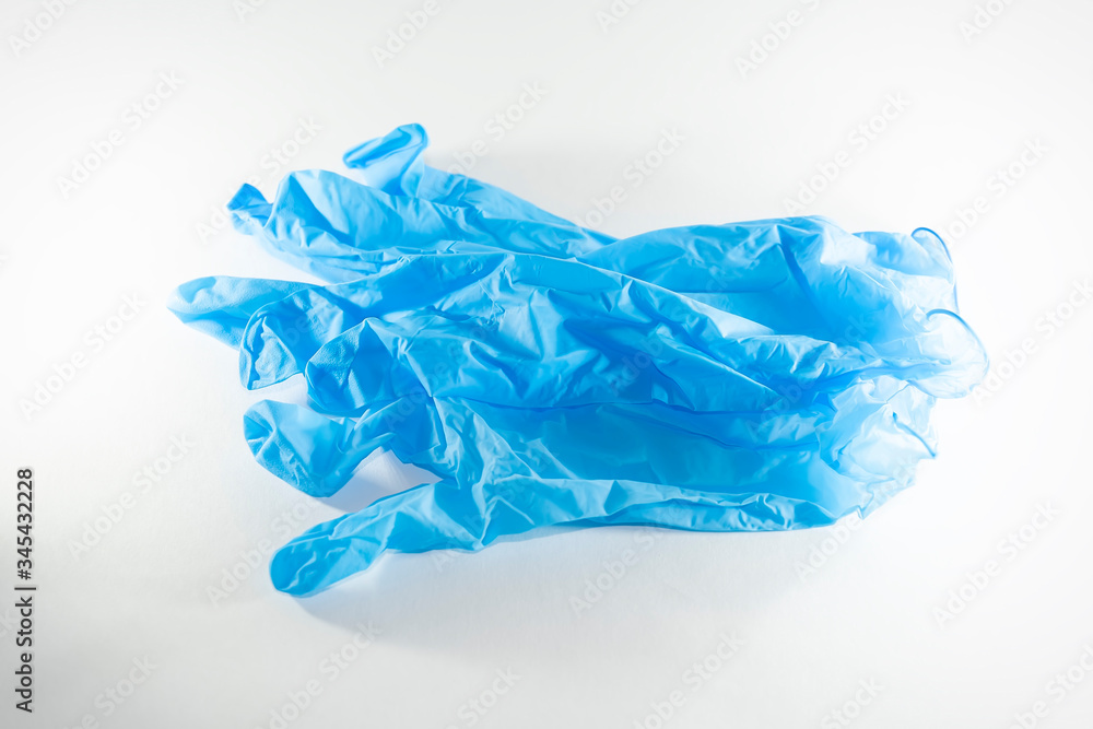 disposable blue medical gloves on a white background disposable blue medical gloves on a white background