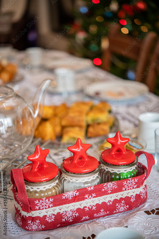 Three glass jar on a Christmas table decoration Three glass jar on a Christmas table decoration