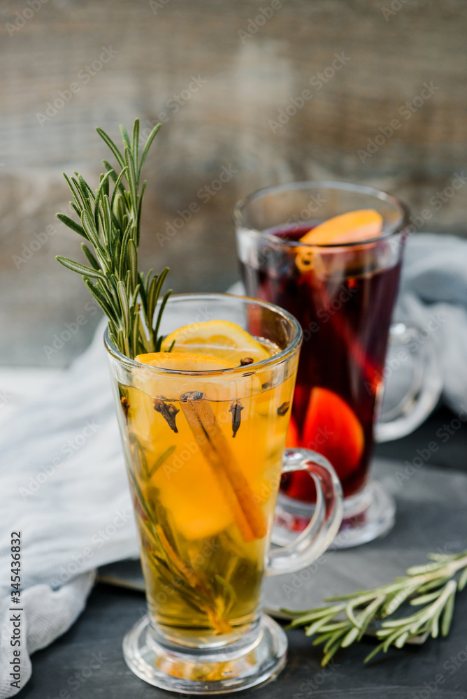 mulled red and white wine wirh spices on dark stone background mulled red and white wine wirh spices on dark stone background