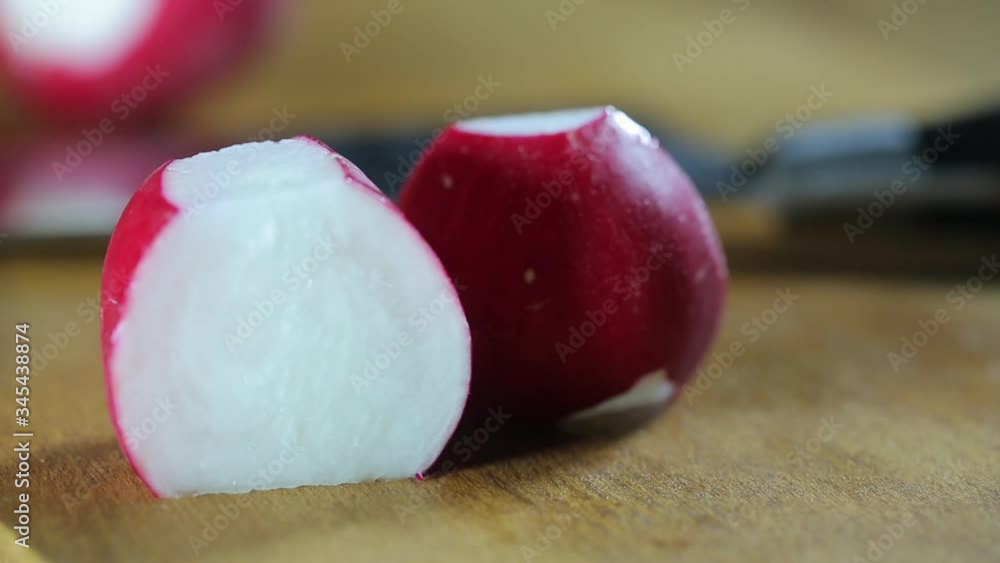 Man cuts fresh radish with knife close-up. Perfect video Man cuts fresh radish with knife close-up. Perfect video