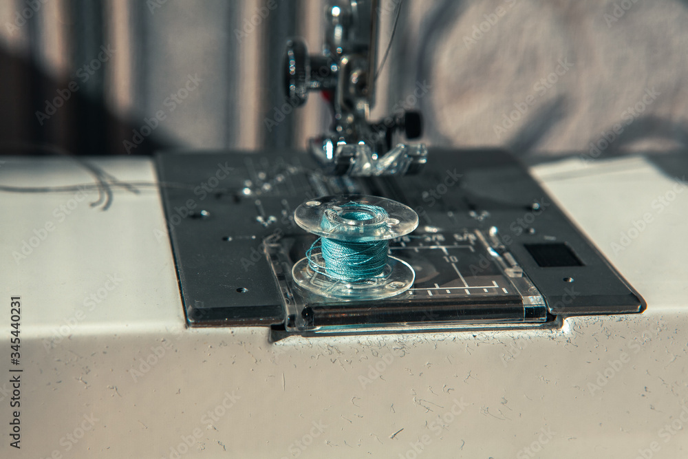 sewing machine and spool with thread sewing machine and spool with thread