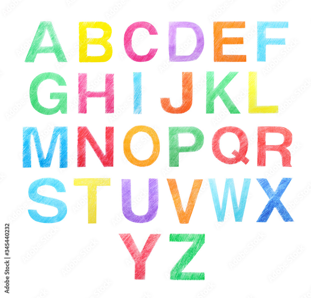 Set of letters written with color pencils on white background, top view