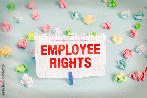 Text sign showing Employee Rights. Business photo showcasing All employees have basic rights in their own workplace Colored crumpled papers empty reminder blue floor background clothespin photo