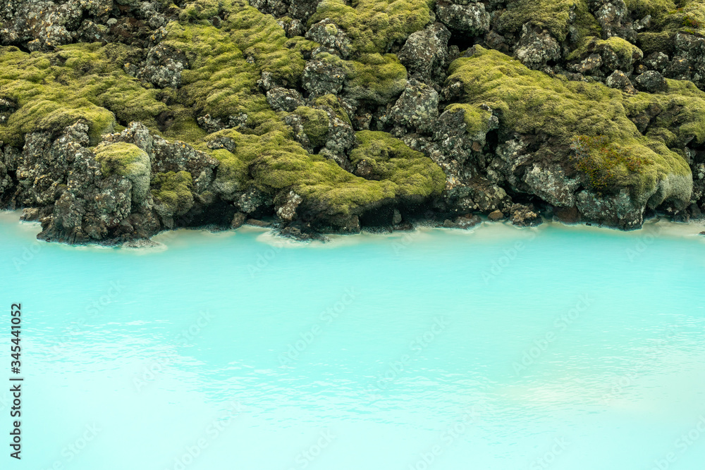 Turquoise colored water and sulfur texture at the blue lagoon near Keflavik in Iceland. Natural, landscape and background concept. Turquoise colored water and sulfur texture at the blue lagoon near Keflavik in Iceland. Natural, landscape and background concept.