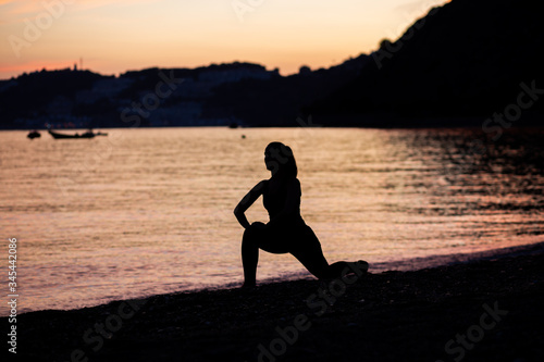 woman doing sports on the beach