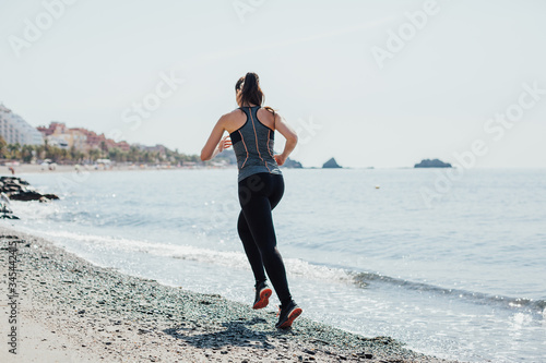 woman doing sports on the beach
