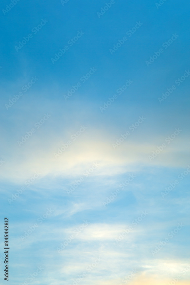 Vertical image white clouds in blue sky in summer day.