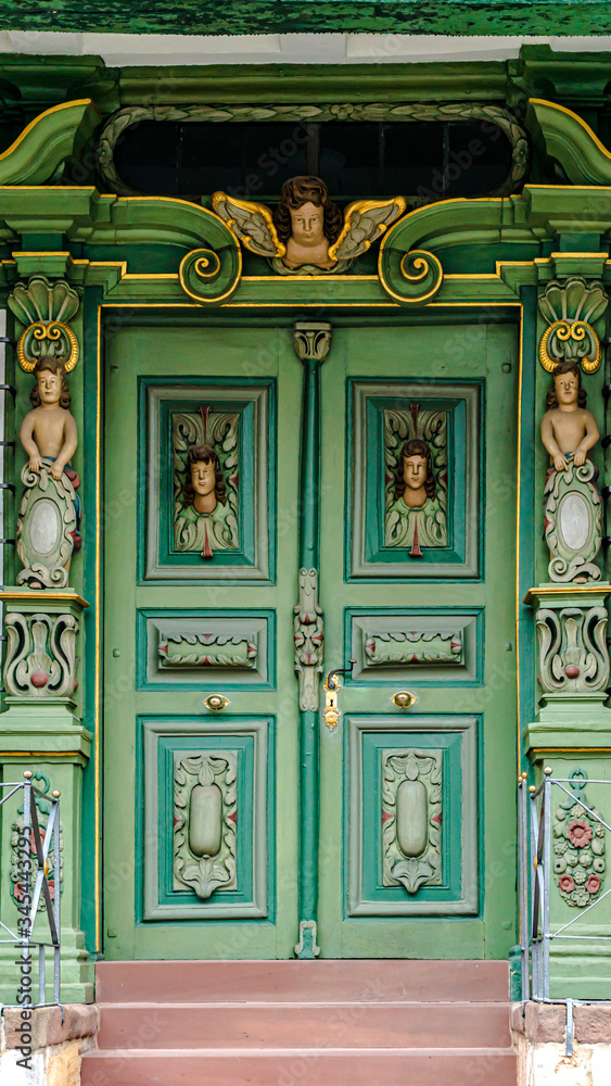 Carved Angels on Wooden Door
