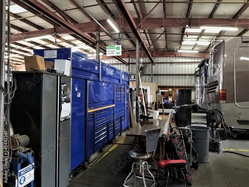 Blue Tool Chest and Equipment Inside an Industrial Garage for Large Vehicles