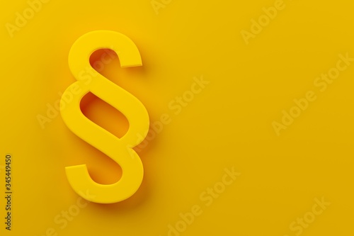 Yellow section sign on yellow background, modern minimal law, justice or legal concept with copy space flat lay top view from above photo