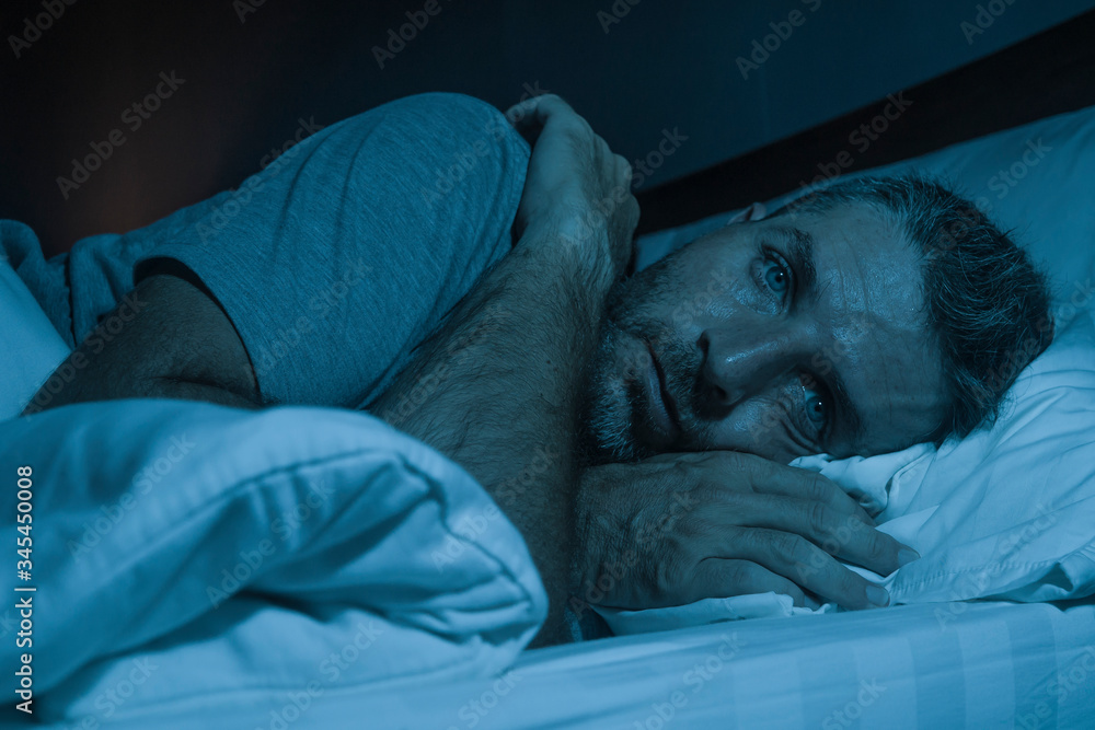 Ταπετσαρία dramatic portrait in the dark of attractive depressed and worried man on bed suf