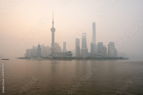 Scenic Panoramic Cityscape of Shanghai  China during foggy morning weather with tall and unique skyscrapers making up the skyline 