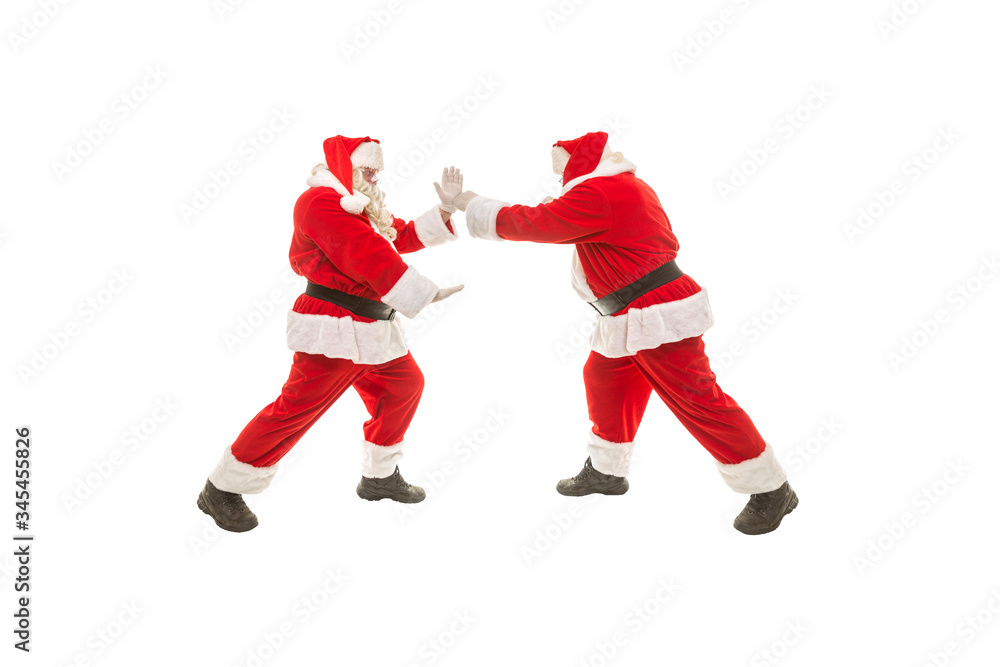 Battle of Santa Clauses on a white background