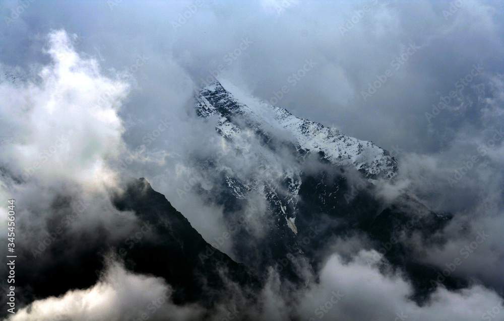 Fototapeta premium Chamonix Mountains and cloudscape in French Alps, France. This picture was taken from the Chamonix Village.