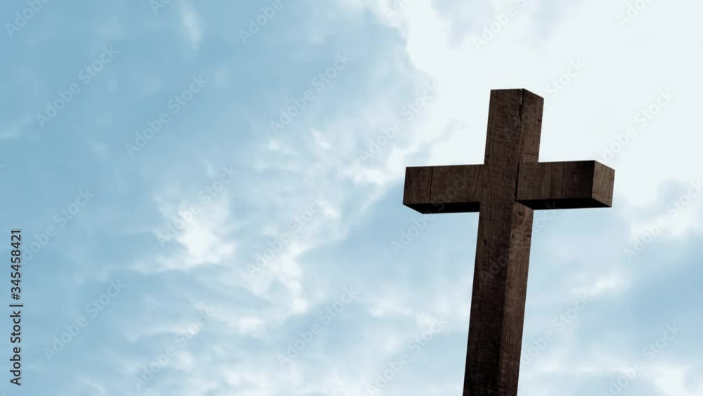 Animation of silhouette of wooden Christian cross over blue clouds on sky Animation of silhouette of wooden Christian cross over blue clouds on sky