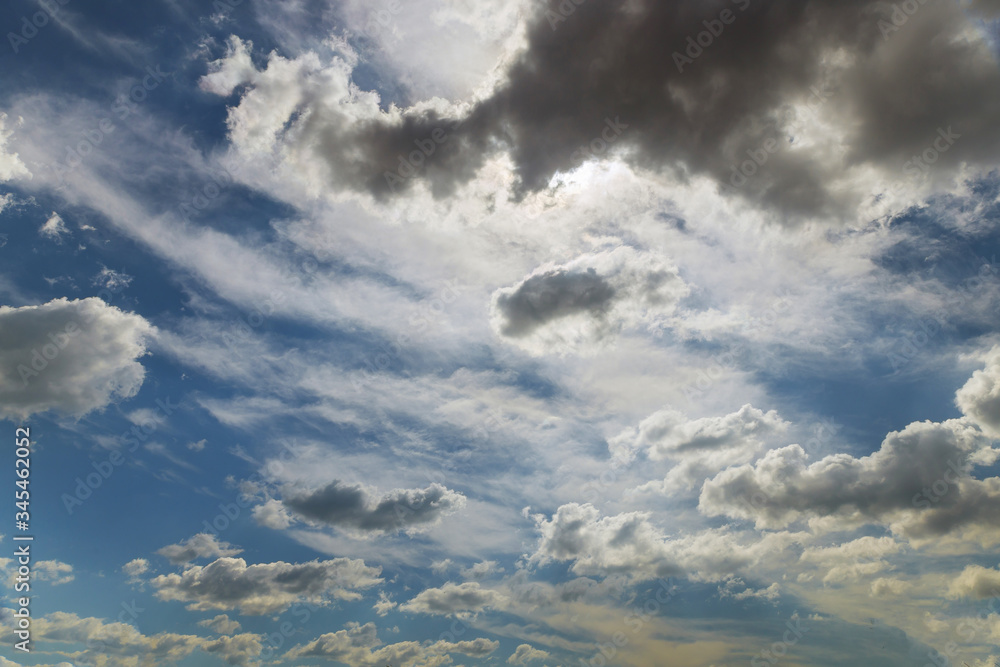 Obraz premium White fluffy clouds in the blue sky