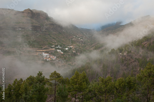 Village of El Juncal in the fog. El Juncal ravine. The Nublo Rural Park. Tejeda. Gran Canaria. Canary Islands. Spain.