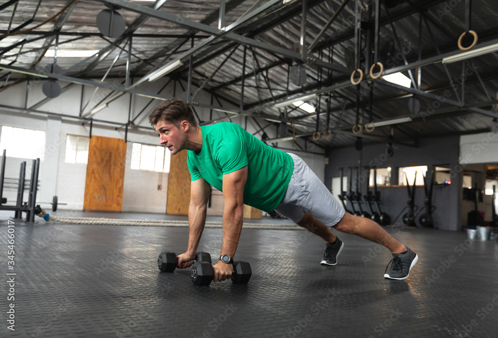 Sporty man practicing cross training Sporty man practicing cross training