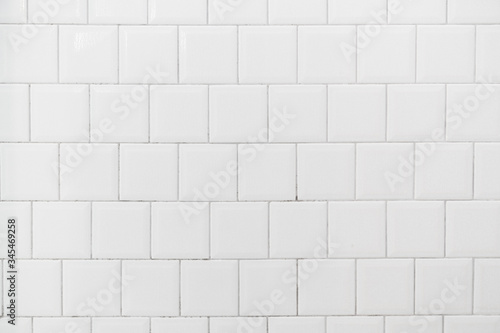 White tile interior wall background.