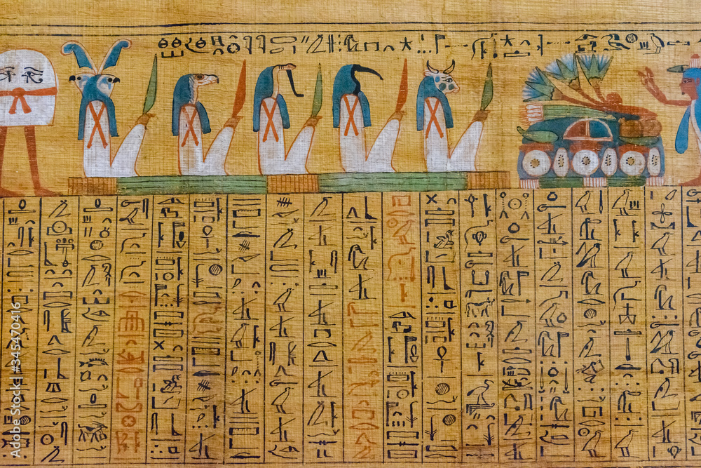 Egyptian ancient papyrus with the different pictures and hieroglyphics