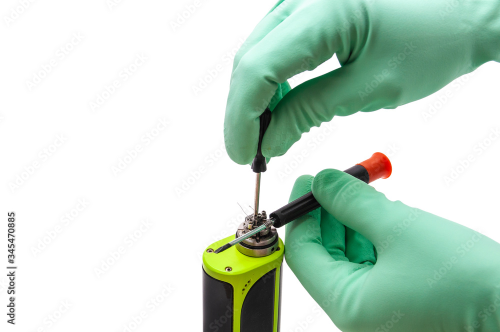 Naklejka premium Repair of an electronic cigarette on a white background