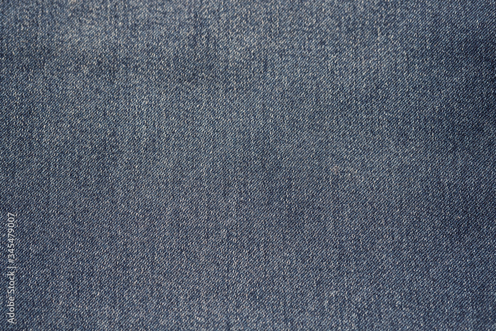 Close-up of blue denim texture. Denim jeans background Close-up of blue denim texture. Denim jeans background