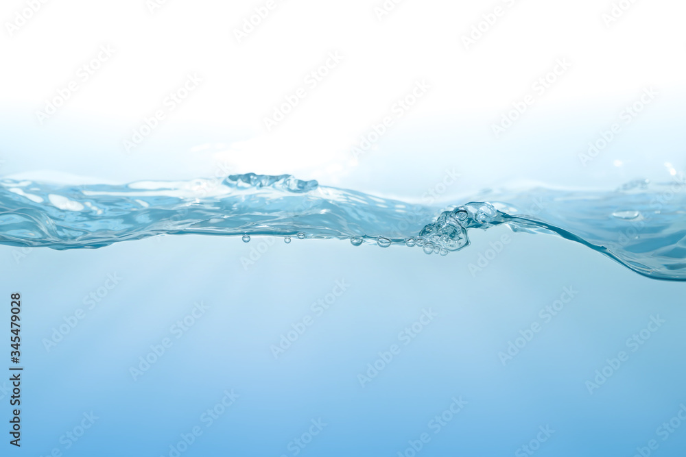 Water splash on blue background. Aqua flowing in waves and creating bubbles. Drops on the water surface feel fresh and clean. Water splash on blue background. Aqua flowing in waves and creating bubbles. Drops on the water surface feel fresh and clean.