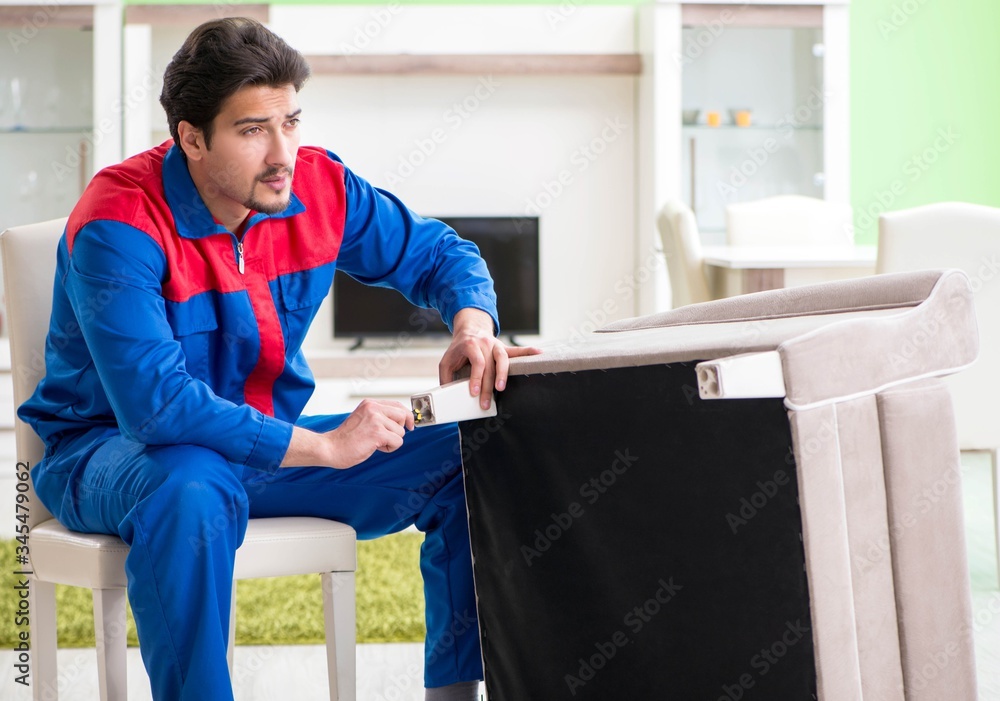 Repair contractor repairing broken furniture at home Repair contractor repairing broken furniture at home