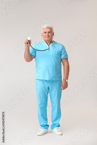Mature male doctor with ste...
