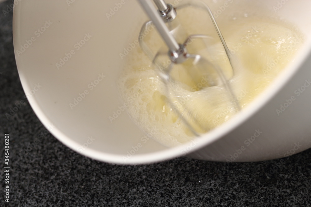Whisking egg whites with handheld mixer. Making Cider Pie Series. Whisking egg whites with handheld mixer. Making Cider Pie Series.