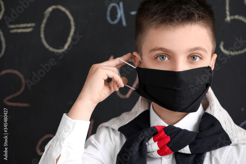 Little schoolboy in protect...