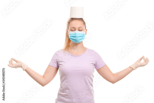 Meditating woman with toile...