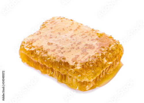 Honeycomb piece. Honey slice an isolated on white background