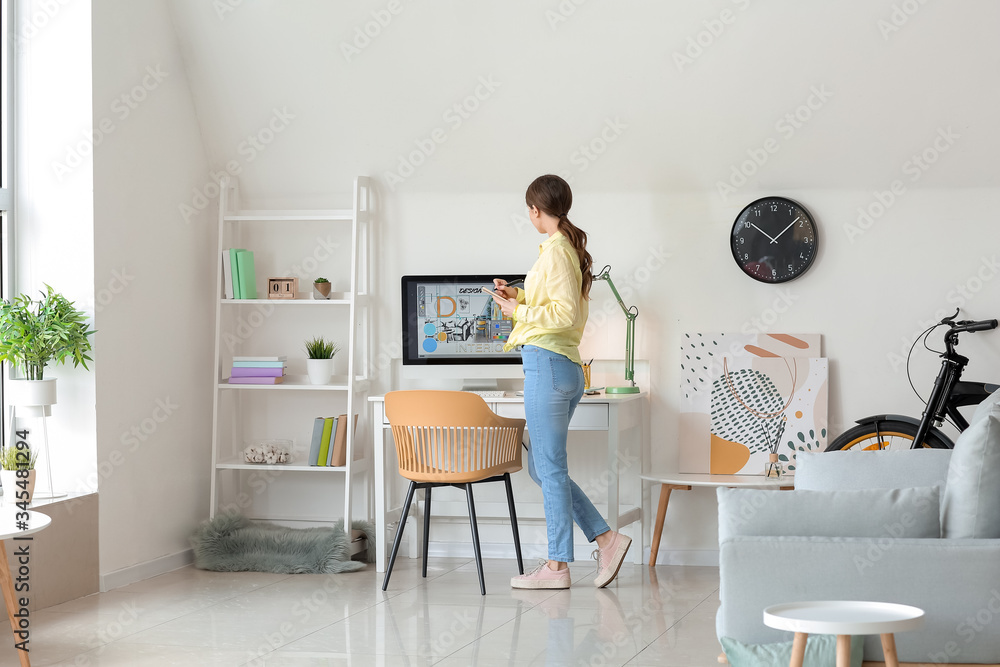 Young female designer working at home Young female designer working at home
