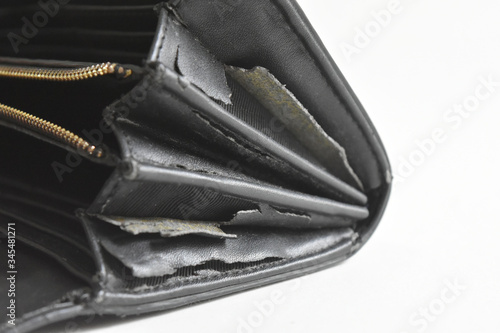 The artificial old leather bag black. Damage to the side and broken pattern texture background.